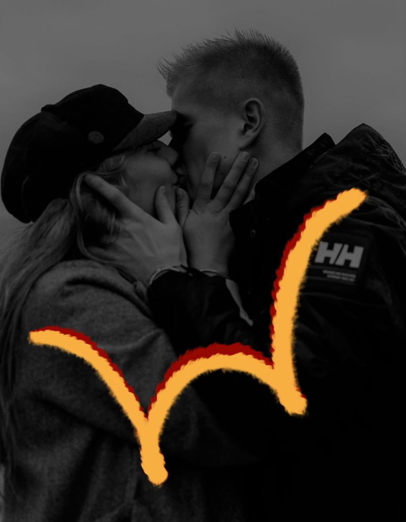 A couple kissing with red and yellow swirls on picture Scorpio woman and Libra man