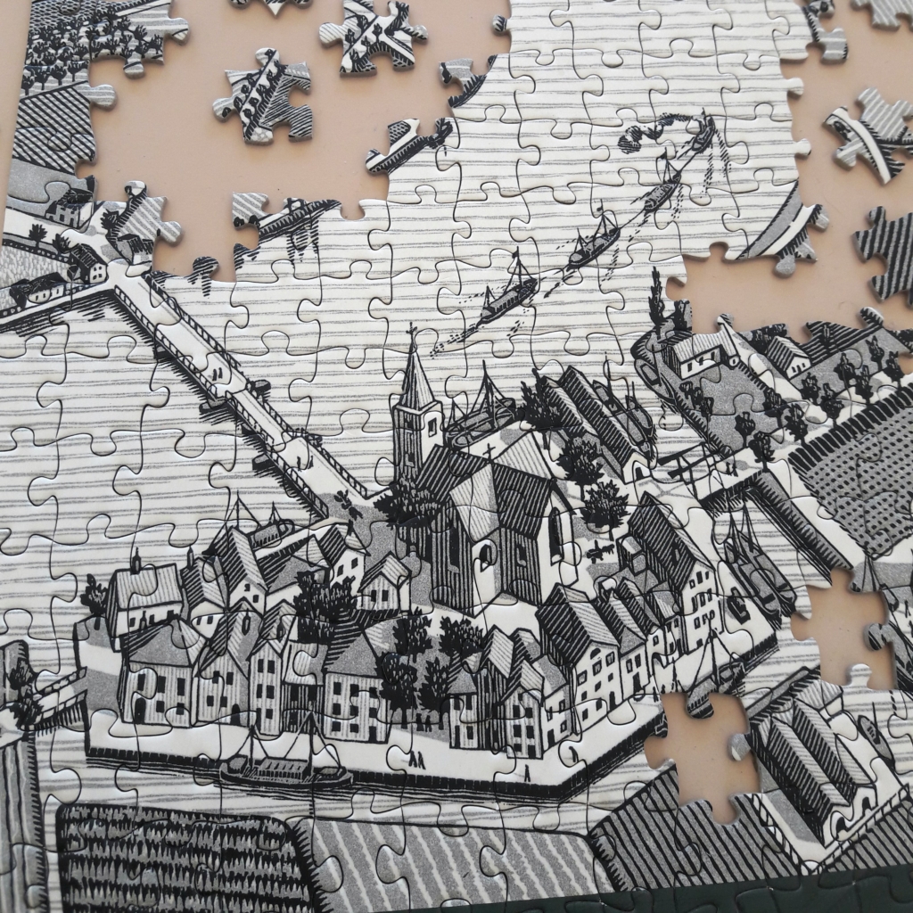 Finish a jigsaw puzzle - black and white cityscape jigsaw puzzle in progress